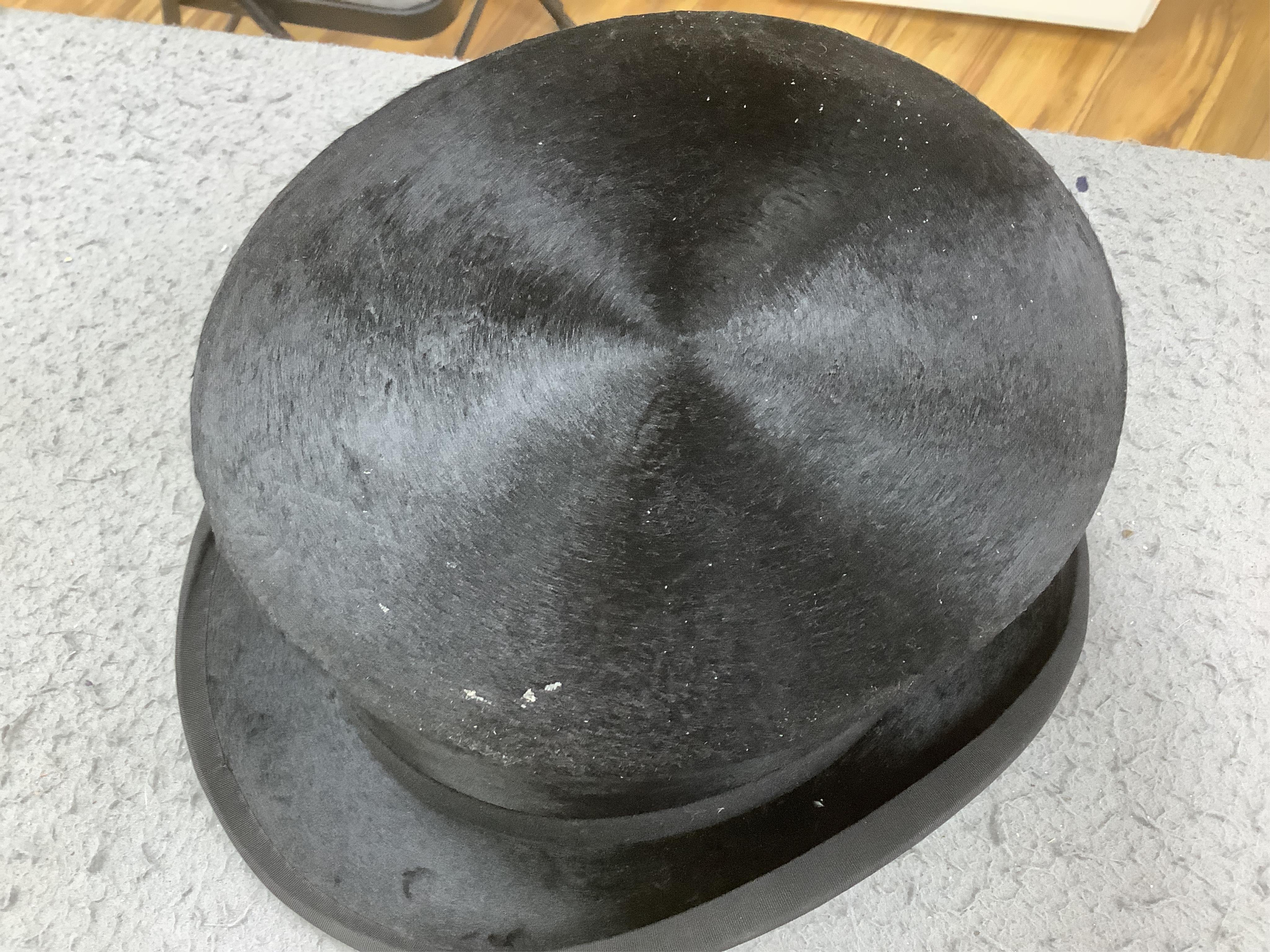 Three gentlemen’s black silk top hats and a similar grey top hat and box. Condition - grey hat good, others poor